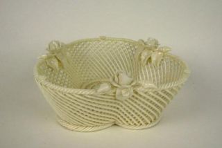 Up for auction is a small size Belleek basket. It is signed as shown