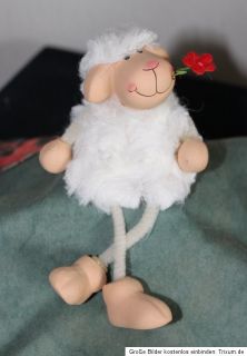 Kleiner Kantensitzer Schaf mit Blume